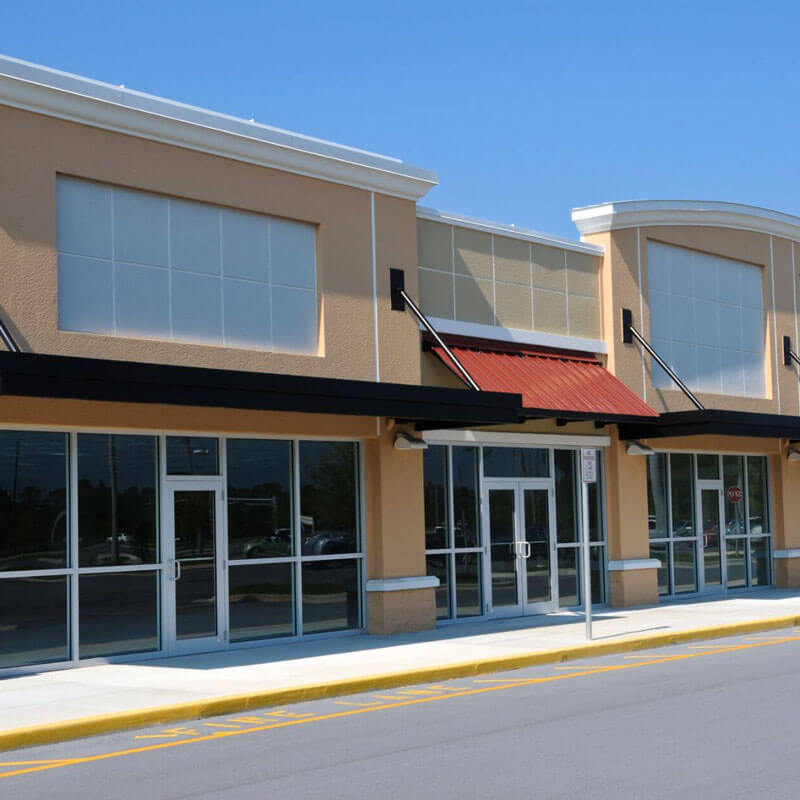 8 foot tall wall of windows on strip mall store fronts